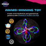 Spin Balls Glow Point Zero spinning balls illuminating a vibrant multicolor rainbow pattern during outdoor flow arts movement.