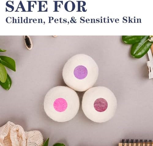 Extra large organic wool laundry balls next to a clean stack of family clothing