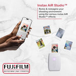 Portable Fujifilm instant photo printer bundle showing the textured design and protective case.