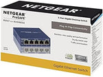 Netgear GS105 gigabit desktop switch retail package content and power adapter.