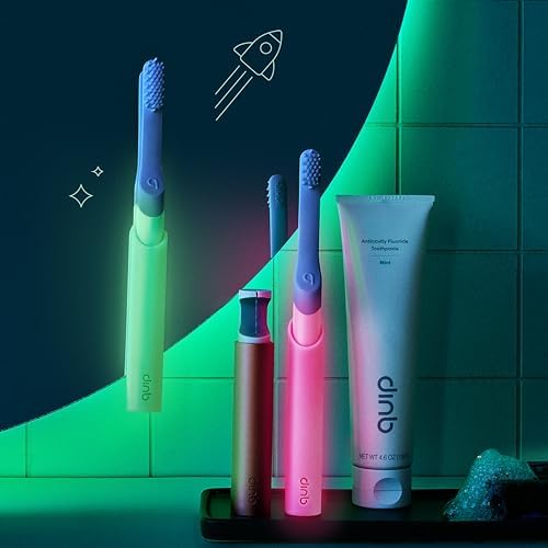 Green glow in the dark Quip electric brush for kids with soft bristles