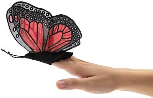 Side view of Folkmanis butterfly finger toy on a hand demonstrating the wing fluttering movement.