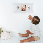 Pearhead gender neutral nursery decor keepsake frame on a tabletop shelf