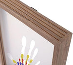 Personalized family handprint artwork glowing in a bedroom setting
