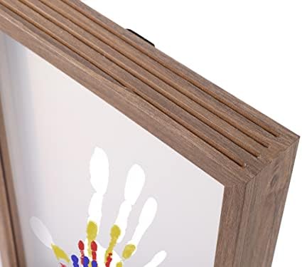 Personalized family handprint artwork glowing in a bedroom setting