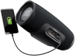 JBL Charge 4 speaker in outdoor setting lifestyle shot