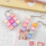 Three piece set of mechanical switch clicker buttons featuring one nine key grid and two four key keychains