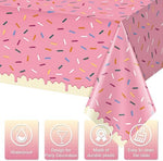 Close up view of the colorful sprinkles and pink frosting design details