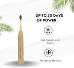 Waterproof bamboo electric toothbrush being rinsed under running water to demonstrate the durable IPX7 protection.