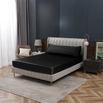 Bedroom interior featuring luxury black satin bed sheet aesthetic
