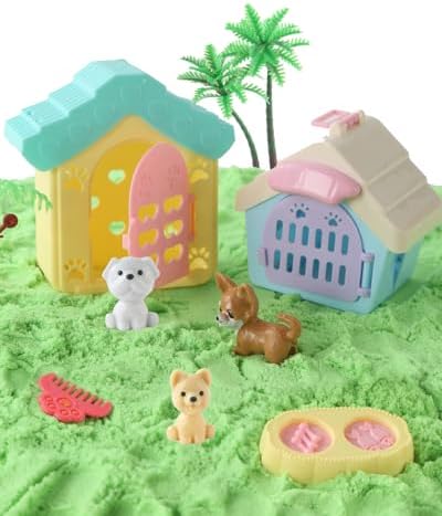 Toddler playing with moldable sand and pet figures in sensory bin