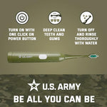 Waterproof military design electric toothbrush being rinsed under running tap water.