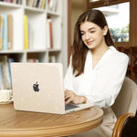 MOSISO lifestyle view of a laptop protected by the starlight sparkly cover on an elegant home office desk