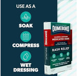 Side panel of Domeboro medicated skin compress powder box detailing safety warnings.
