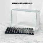 Multiple display boxes stacked vertically on a desk