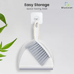 Small cleaning brush snapping into dustpan for storage
