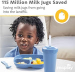 Toddler enjoying a meal on a Re-Play divided plate