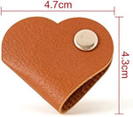 Tangle free phone wire management setup using a cute heart design faux leather cord keeper strap
