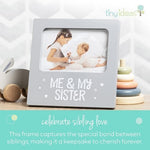 Tiny Ideas sibling keepsake photo frame placed on a modern nursery tabletop shelf