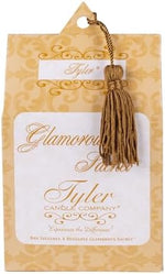 Four reusable dryer sachets displayed next to the Tyler Candle Company packaging.