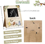 Classic Winnie the Pooh pregnancy milestone sign displayed on a nursery tabletop.
