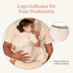 Ergobaby natural beige baby carrier with essentials placed inside the front storage pocket.