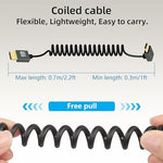 RIIEYOCA flexible spring camera cable stretched to showcase elastic length extension capabilities