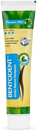 Natural toothpaste texture on a toothbrush emphasizing fluoride free remineralizing benefits