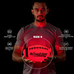 Impact activated night play sports ball being plugged into USB-C charger
