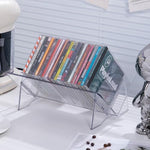 Top angle view of empty clear plastic compact disc storage racks.