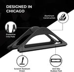 HumanCentric matte black laptop stand showing stable rubber feet base