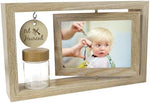 Customized baby girl first haircut photo frame placed beautifully on a nursery tabletop.