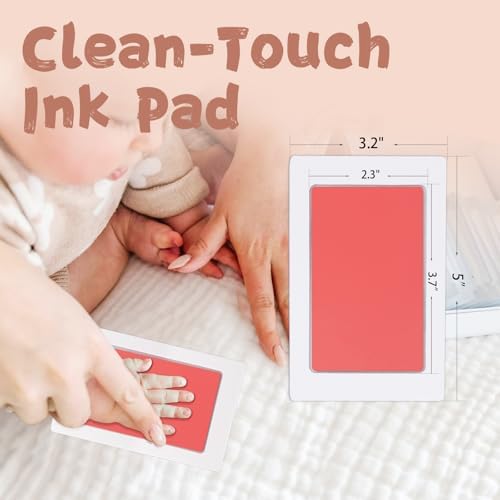 Detailed black ink baby handprint transferred onto love at first sight art card.