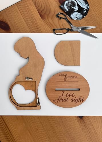 Close up of the heart shaped photo slot on the natural beechwood pregnancy keepsake frame.