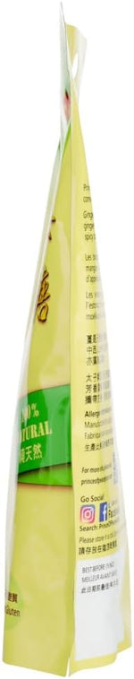 Soft and chewy texture of a single opened tropical mango ginger chew.