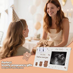 Nursery wall display featuring the bear themed sonogram frame alongside baby nursery decorations.