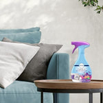 Febreze Gain Moonlight Breeze fabric spray application on sofa