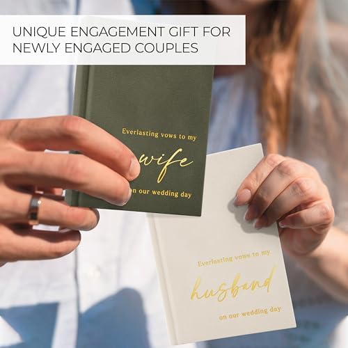 Zicoto vow books held in hands during a wedding ceremony