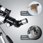 White refracting telescope with altazimuth mount and five by twenty-four finderscope attachment