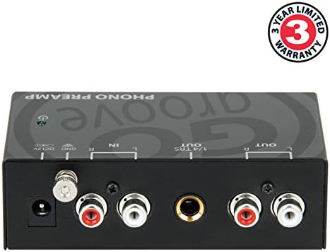 GOgroove vintage turntable preamplifier with the included twelve volt power adapter displayed on a flat surface.