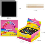 Black coated scratch-off note sheets revealing bright rainbow colors underneath with wooden stylus