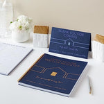Two navy blue spiral-bound guest books for real estate agents