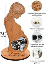 Heart's Sign sonogram frame standing on a nursery table holding a baby scan picture.