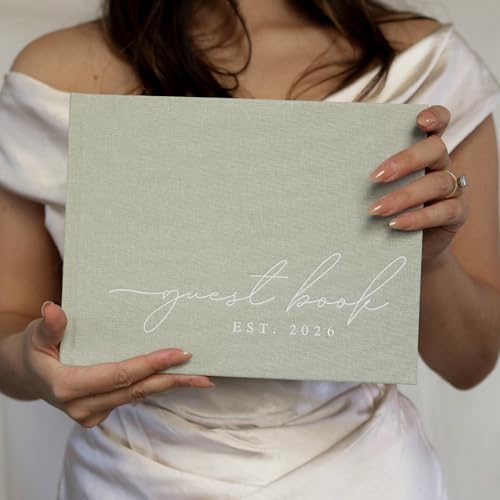 Open wedding guest book showing lined and blank pages