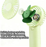 Staol green mini fan being held comfortably for outdoor hiking
