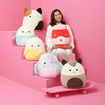 Squishmallows Mak the Lavender Cat held for scale