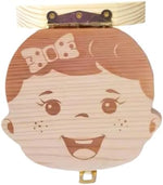 Pambo keepsake box open showing individual tooth storage slots