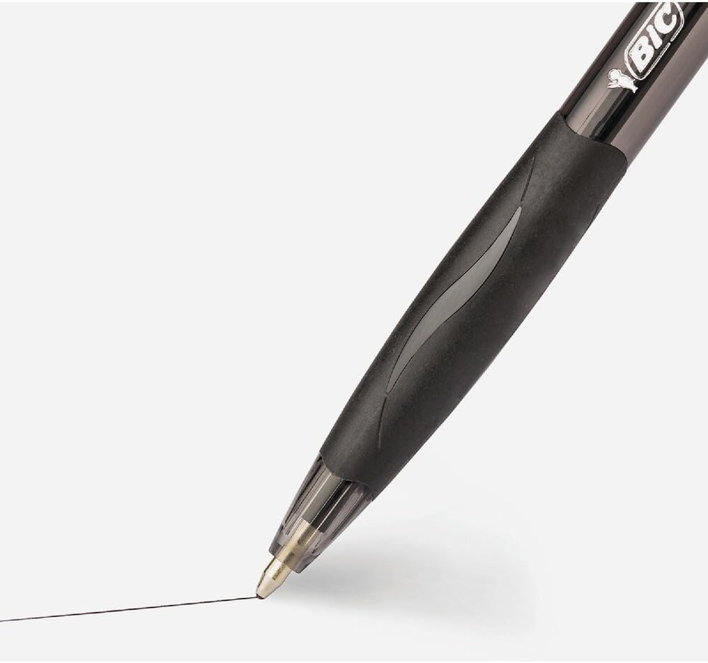 BIC Glide black ballpoint pen writing smooth lines on a notebook page