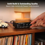 Fosi Audio Q4 desktop DAC unit angled setup view driving audiophile grade headphones.