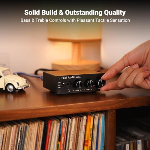 Fosi Audio Q4 desktop DAC unit angled setup view driving audiophile grade headphones.